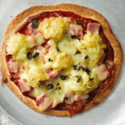 Mini pizza with ham, cheese and pineapple