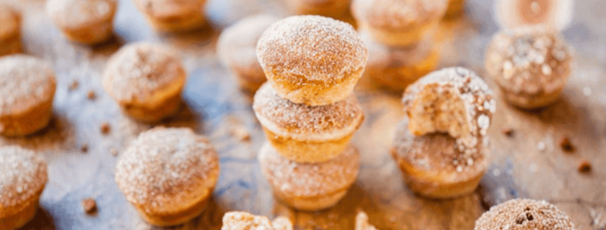 Small doughnuts shaped like muffins with sugar on top