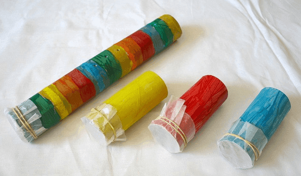 Paper towel roll with baking paper on the ends to make maracas